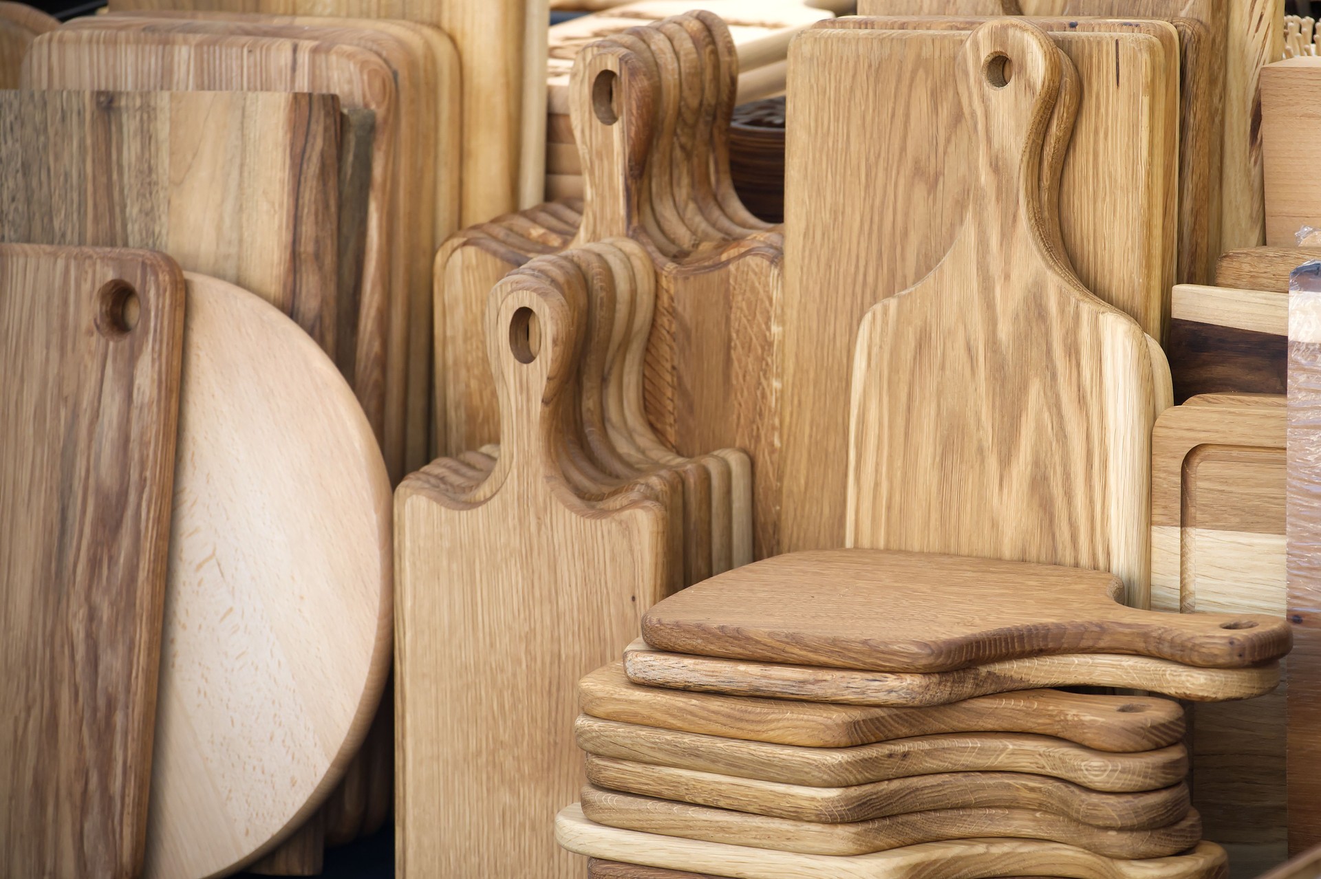 An assortment of wooden cutting boards showcase their natural grain and crafted design.